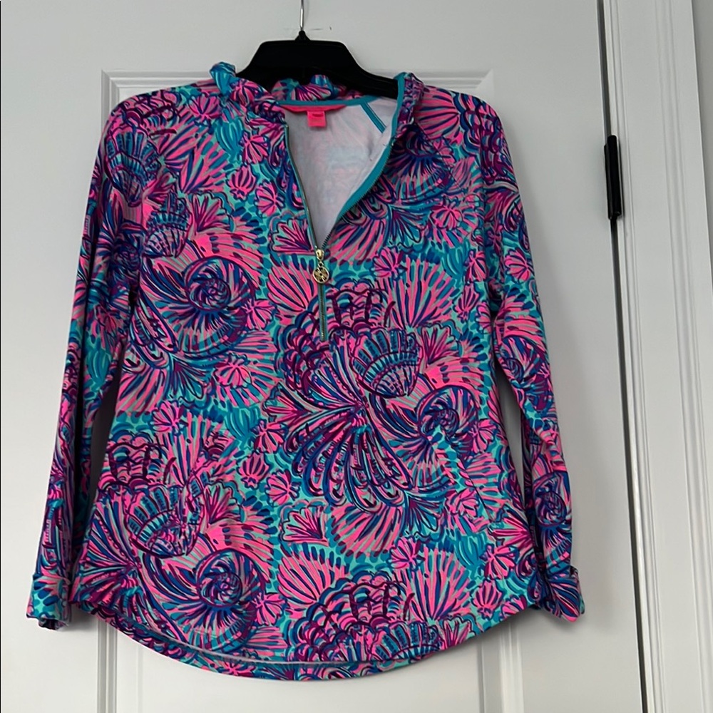 Multicolored long sleeve button down shirt with polo collar and graphic design